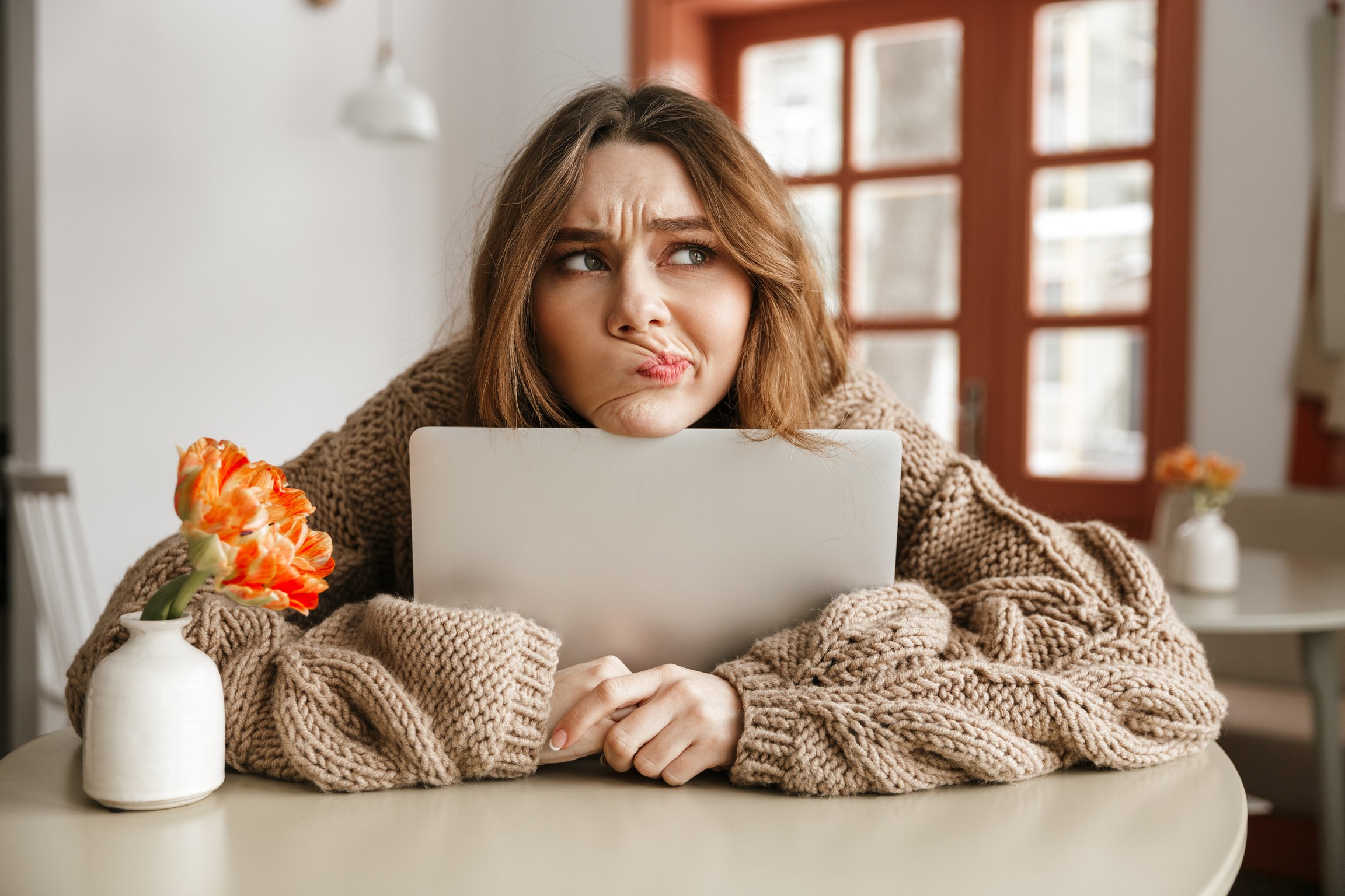 Photo of Disappointed Woman in Sweater Looking Aside with Suspic